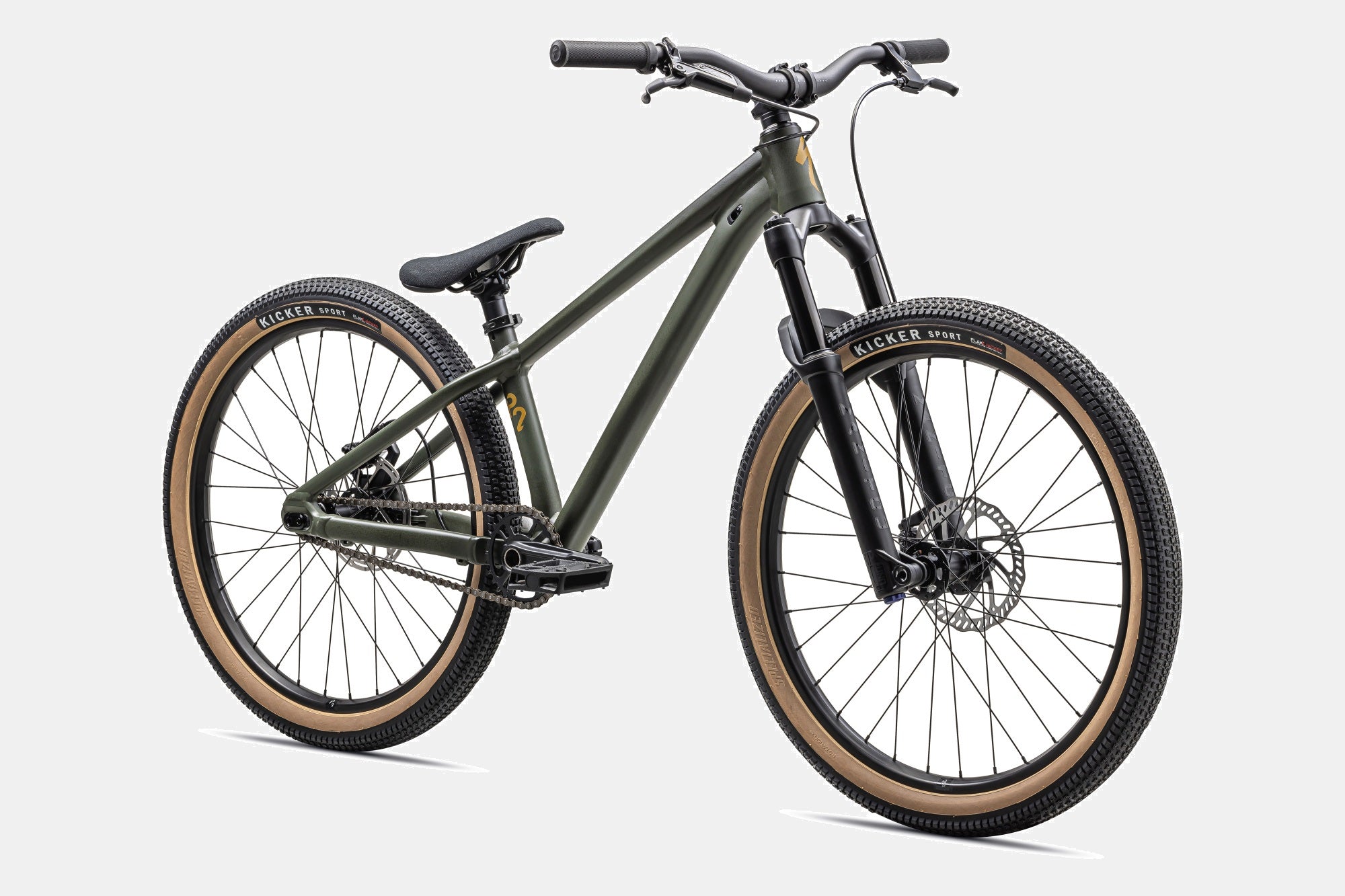 Grünes Specialized P-Series Dirtjump-Bike mit schwarzen Reifen und braunen Seitenwänden, ideal für Stunts und Sprünge.