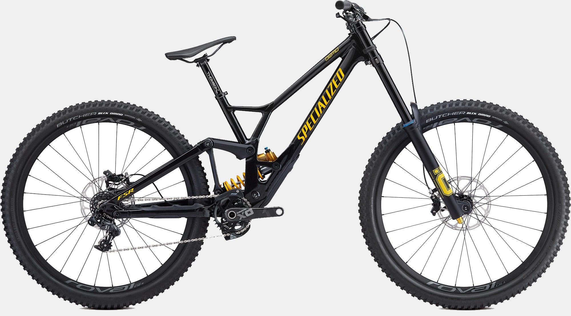 Schwarzes Specialized Demo Mountainbike, geeignet für Downhill-Fahrten, mit gelben Details und robusten Reifen.