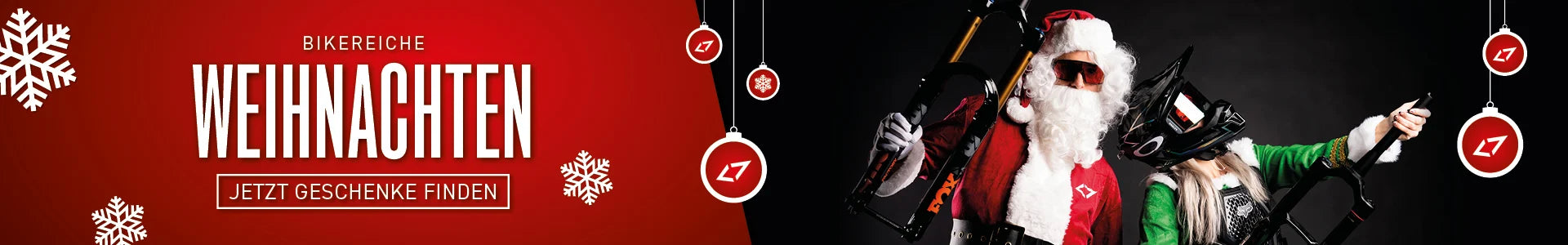 Weihnachtsbanner mit Santa in Bikerkleidung, Helm und Fahrradgabel, daneben Schneeflocken und Weihnachtsdeko.