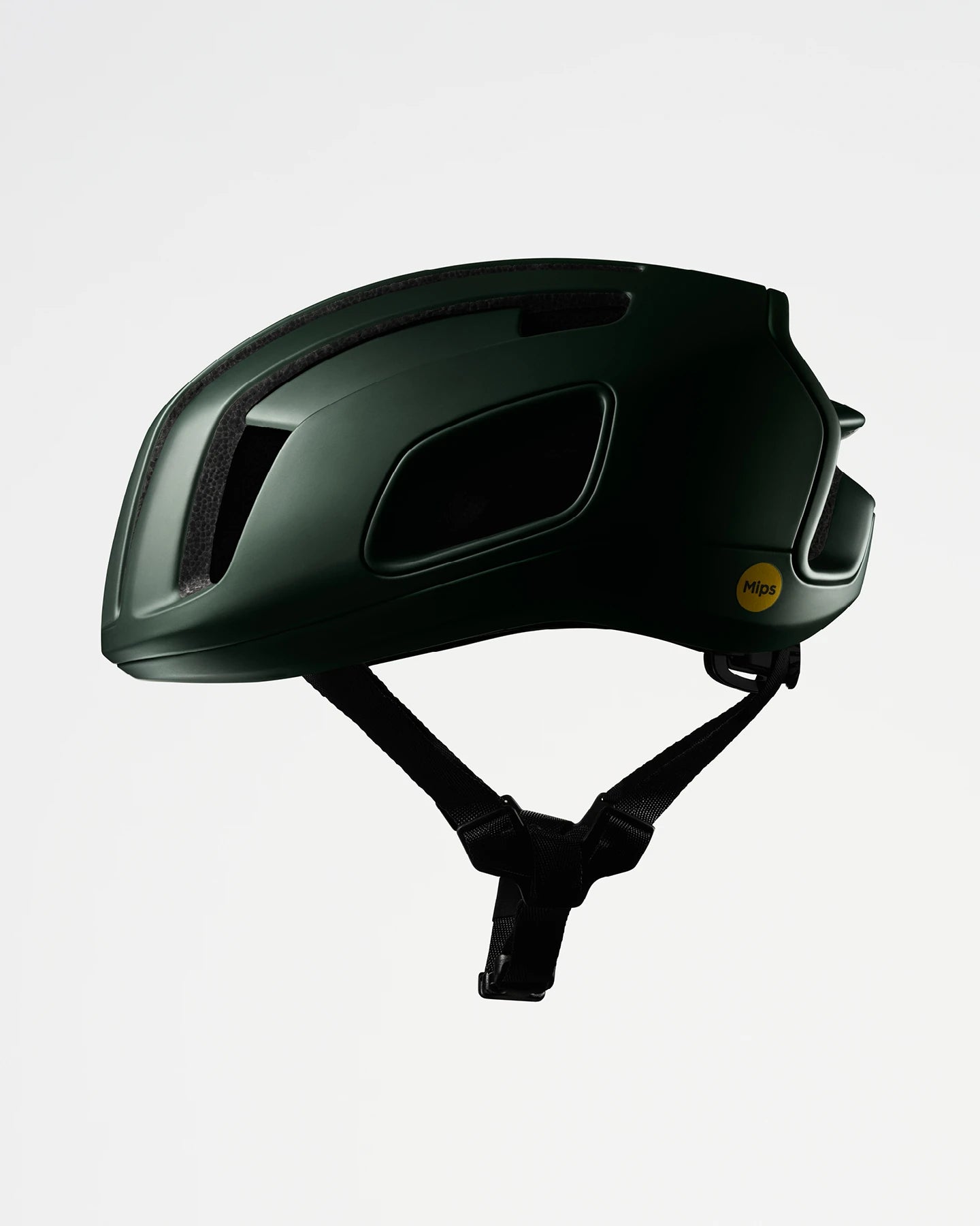 Dunkelgrüner Fahrradhelm von POC mit MIPS-Technologie, seitlich gezeigt. Ideal für Radfahrer.