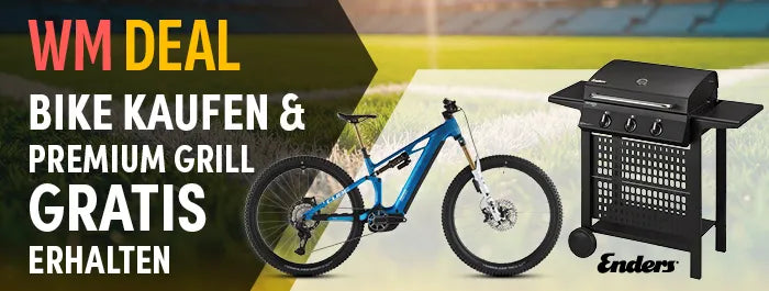 Mountainbike neben Enders Gasgrill, Angebot: Kauf eines Aktionbikes, Erhalt eines Gratis-Grills, WM Deal Text im Hintergrund.